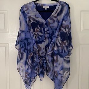 Jennifer Lopez bat winged sleeve top.